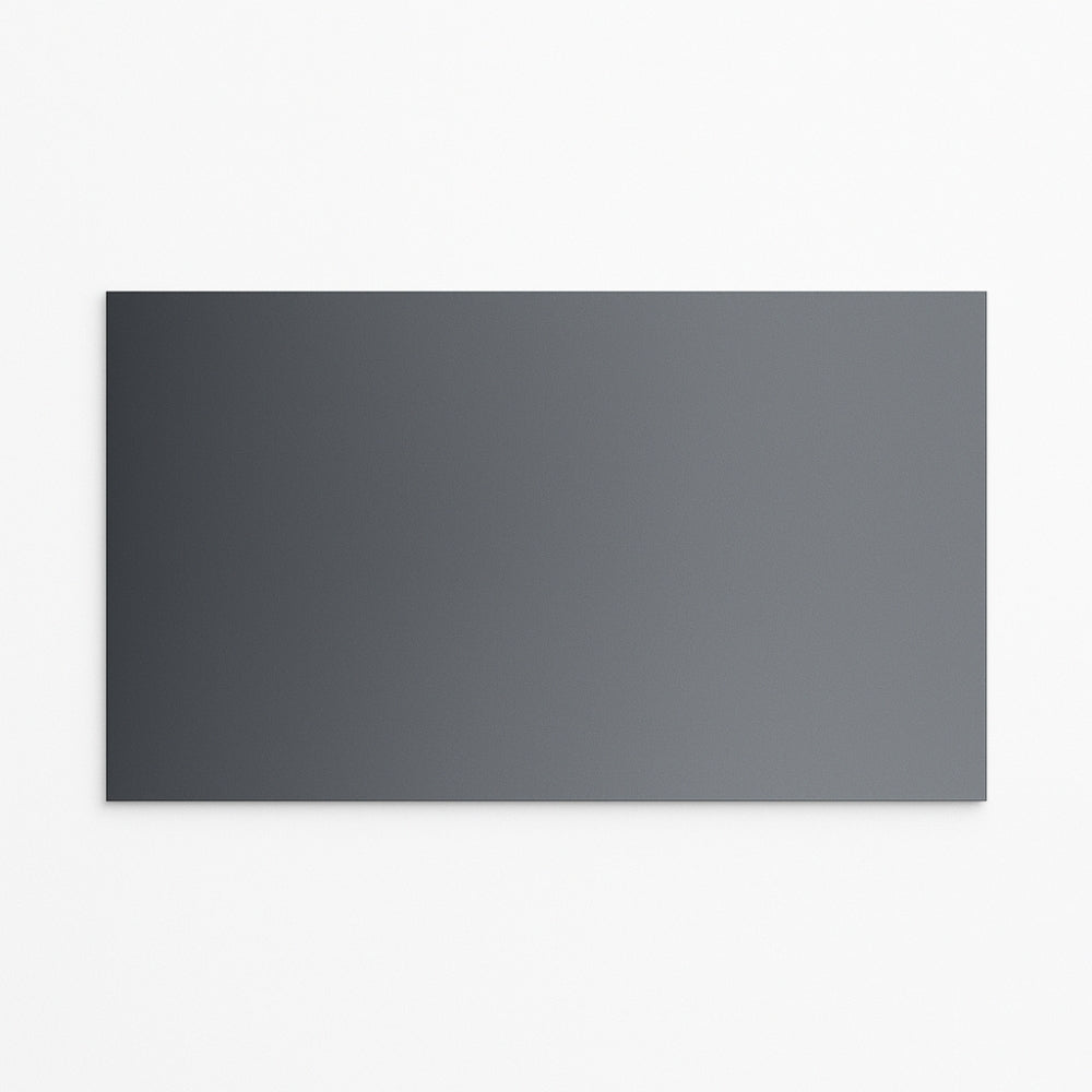 A rectangular ALR Black Crystal Projector Screen by The Projection Room, in dark grey, is mounted on a plain white wall. Its smooth matte surface delivers deep blacks and enhanced contrast without any visible patterns or textures.