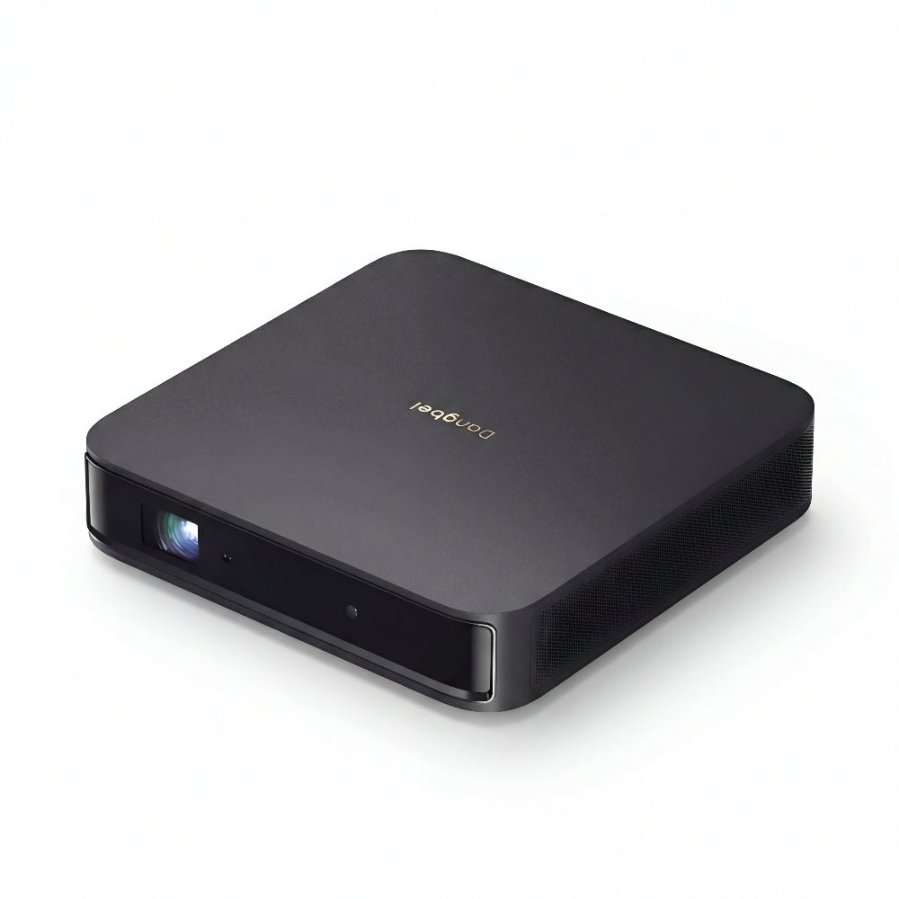 A sleek, black rectangular Dangbei Atom projector with rounded edges and a front-left lens, sporting the Dangbei logo on top and a powerful laser light source, set against a plain white background.