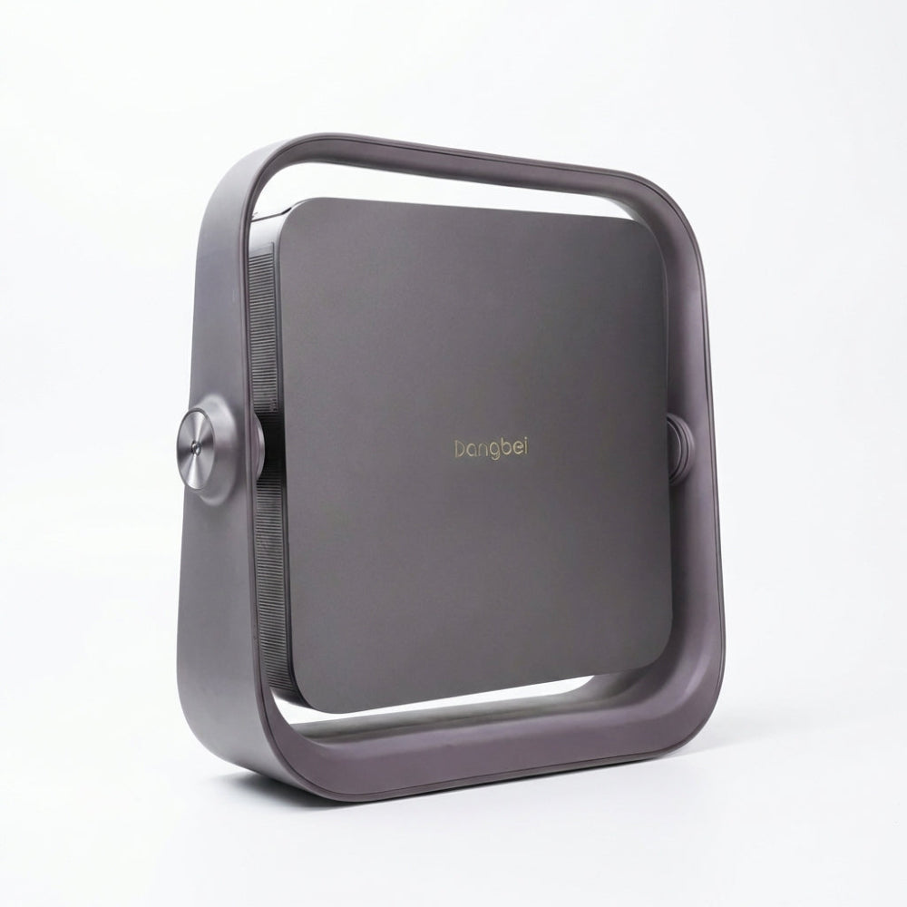 The Dangbei Atom is a sleek, modern, square-shaped portable projector with rounded edges and a metallic frame. The Dangbei logo appears at the center, all set against a plain white background.