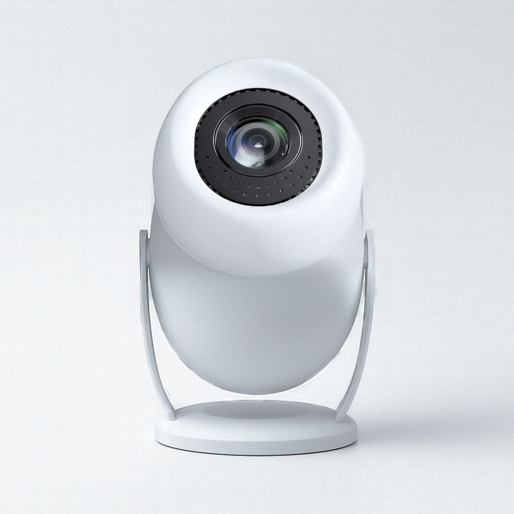 The Projection Room's Neo Cloud Mini Projector, featuring a sleek white design and round lens, sits on a minimalist stand and faces forward against a plain light backdrop.