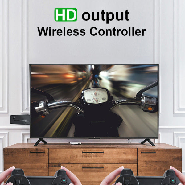 Two people use wireless controllers to guide virtual motorcycles on-screen. The Spotlight Projector Pro + Game Stick Bundle by The Projection Room is displayed above. A wooden stand supports the TV and console, ideal for stylish and intense gaming nights.