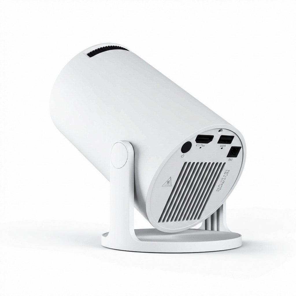 The Projection Room's NEW Spotlight Projector, a white cylindrical short-throw model, sits angled upward on a minimalist stand. Its back panel has ports, vents, and buttons—ideal for smart projection in modern apartments.