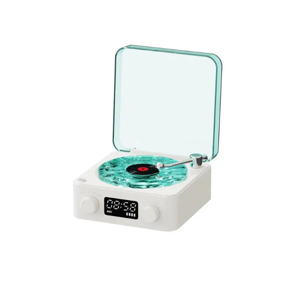 The Projection Rooms Vinyl Speaker Lamp has a white retro turntable and a transparent teal lid resembling ocean waves. It includes a digital clock, front knobs for high-quality sound, and spins a small red and black record.