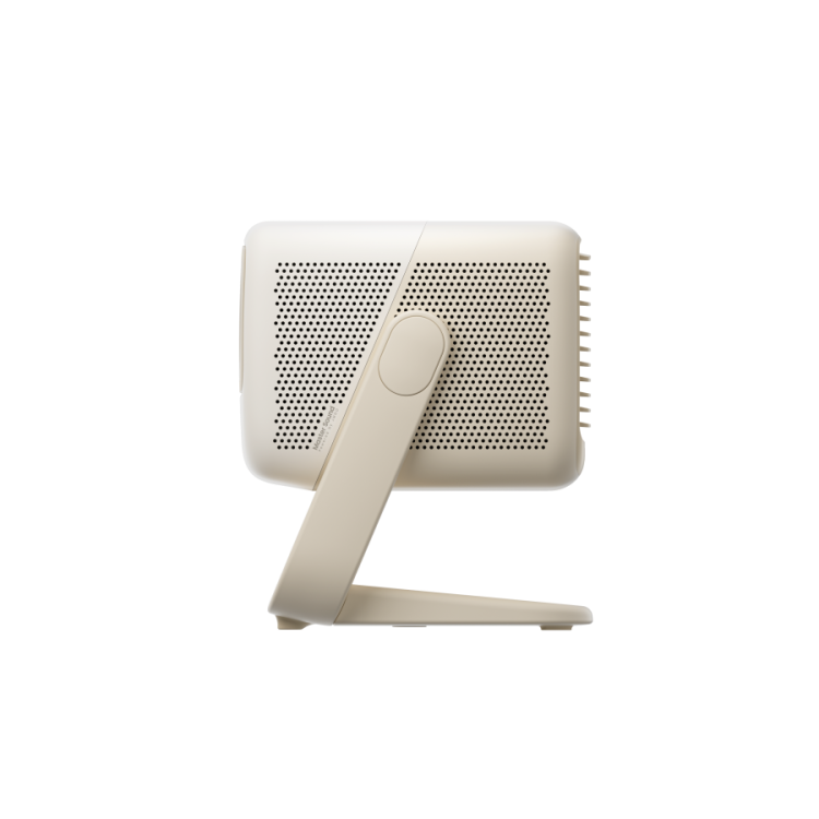 The JMGO N1S Nano by JMGO is a beige, rectangular projector with a perforated surface and angled stand—perfect for enjoying Google TV on a big screen.